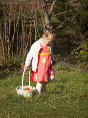 Wall Mural - Toddler on Easter Egg Hunt