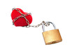 Heart tied with chain to padlock.