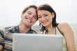 © Alliance - Portrait of young couple with laptop