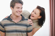 © Alliance - Portrait of smiling young couple having fun