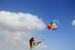 © dubova - Young woman with colorful balloons