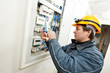 © Kadmy - Electrician installing energy saving meter