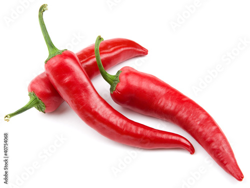 Obraz w ramie Trzy czerwone papryczki chili na białym tle