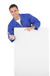 © auremar - Plumber stood behind blank poster with mobile