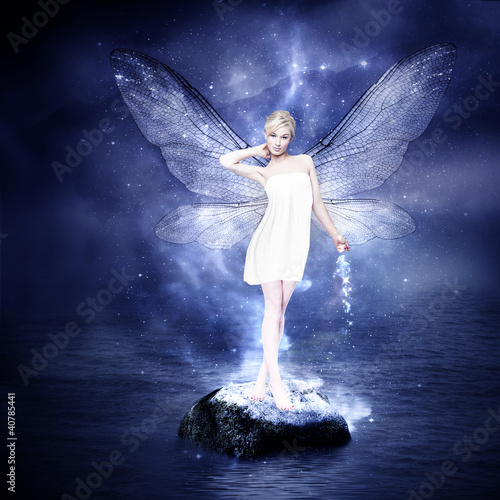 Fototapeta na wymiar Magical young blond woman as fairy