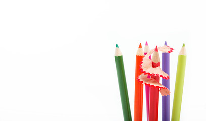 Close up of color pencils with different color over white backgr