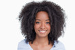 © WavebreakmediaMicro - Young woman with curly hairstyle showing a great smile