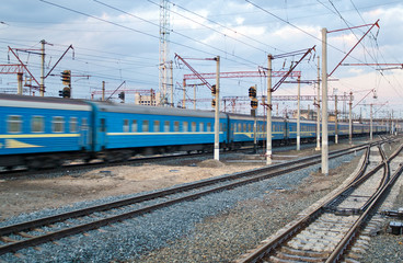 Canvas Print - Passanger train passing the station