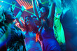 © Kzenon - Party people dancing in disco or club