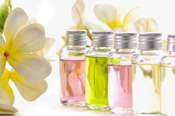 still shot of frangipani flowers with essential oil