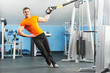 bodybuilder man doing exercises in fitness club