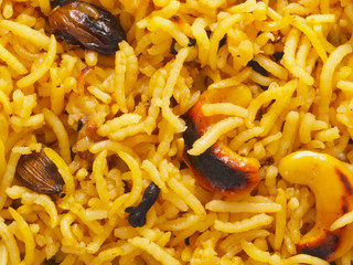 Sticker - close up of indian turmeric rice food background