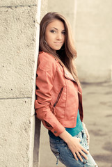 Wall Mural - Happy young girl in red jacket