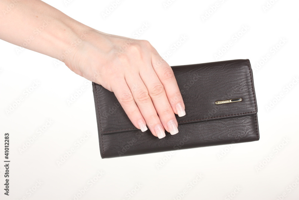 Women's purse in hand isolated on white