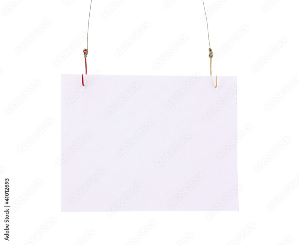 Empty sheet of a paper on fish hooks isolated on white