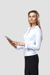 Wall Mural - Young beautiful woman in business wear at work