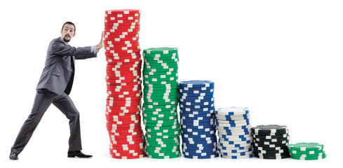 Businessman and casino chips on white