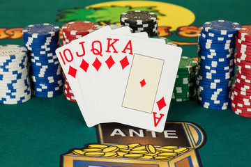 Royal flush cards with chips