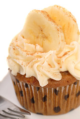 Wall Mural - Delicious carrot cake cupcake with cream cheese frosting, sliced