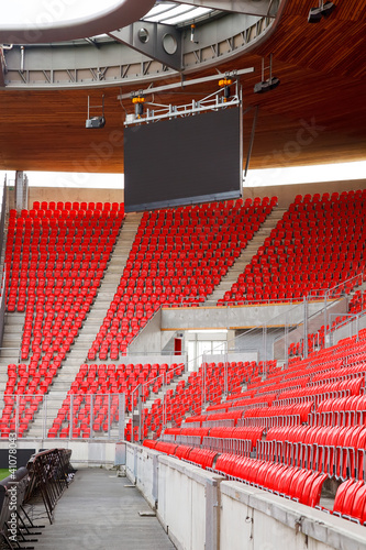 Obraz w ramie Corner of an empty football stadium with projection screen