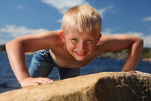 Small Boy On A Sunny Beach