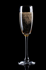 Wall Mural - glass of champagne on black background