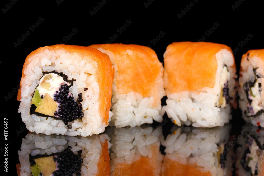 Tasty rolls in line isolated on black