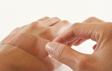 two hands with bandage