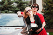 Young couple with a new car