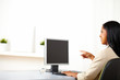 © pablocalvog - Businesswoman pointing to a monitor