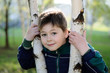 The Boy in the birch forest in early spring