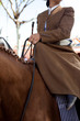 Horse woman wearing the traditional spanish traje corto