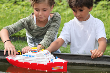 Children playing with boat