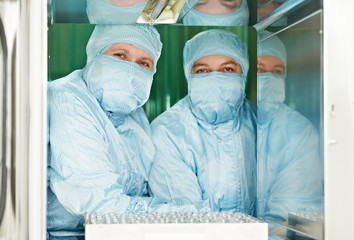 two pharmaceutical factory workers