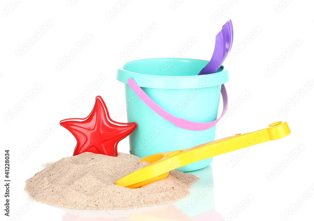 Children's beach toys and sand isolated on white
