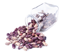 Purple Speckled Beans Scattered On A White Background