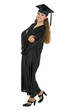 © Alliance - Full length portrait of happy graduation student woman
