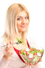 Wall Mural - Young woman eating salad