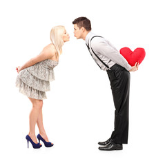 Poster - Full length portrait of boyfriend and girlfriend giving kisses