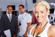 © michaeljung - pretty female gym trainer closeup portrait
