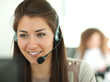 © opolja - Female customer support operator with headset and smiling