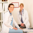 © CandyBox Images - Two female doctor sitting surgery office