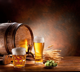 Sticker - Beer barrel with beer glasses on a wooden table.