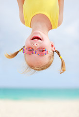happy little girl upside down