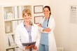 © CandyBox Images - Two female doctor standing at medical office