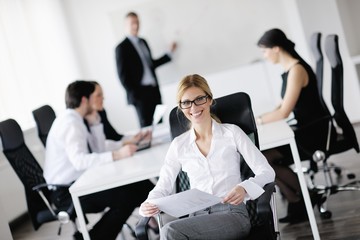 Wall Mural - business woman with her staff in background