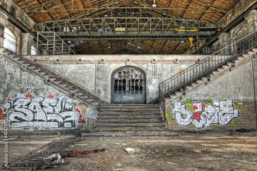 Fototapeta na wymiar Imposing staircases inside the hall of an abandoned coal mine