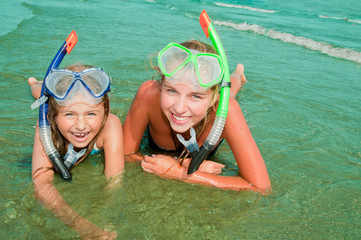 Wall Mural - Summer beach - lovely snorkel girls in the sea