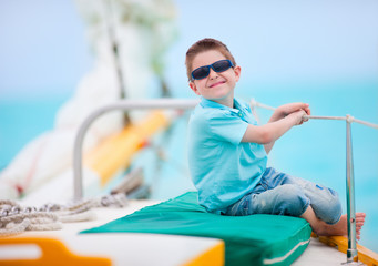 Wall Mural - Cute boy on luxury yacht