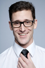 Wall Mural - Young handsome businessman in white shirt.